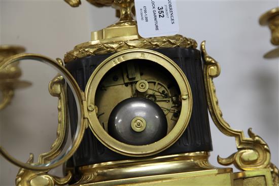 A late 19th century French bronze and ormolu clock garniture, 11.5in.